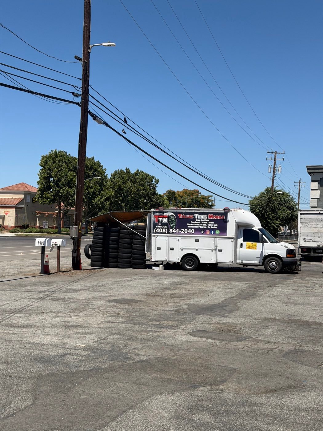 TTM — Téllez Tires Mobile service vehicle parked with tires stacked beside it