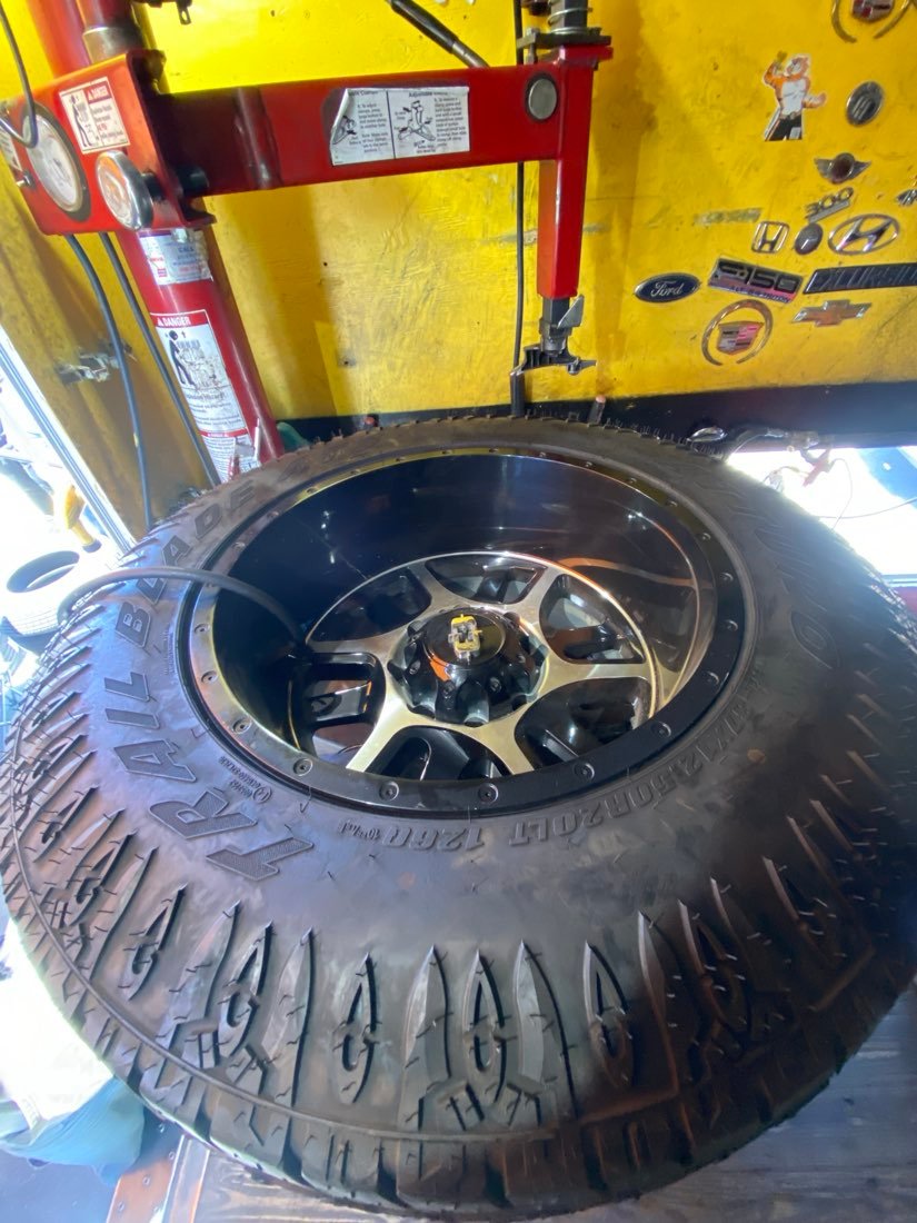 Off-road tire mounted on the tire-changing machine
