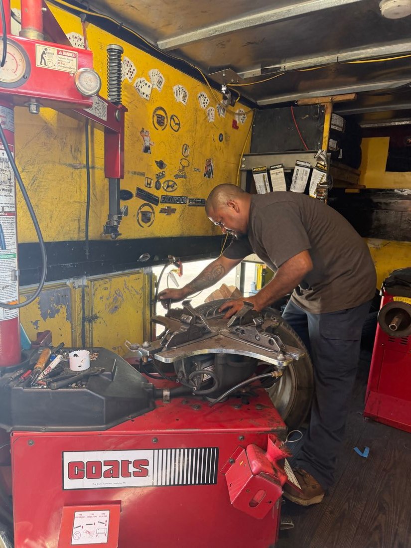 Technician performing brake and rotor service